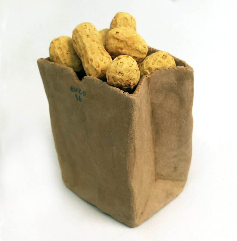 miniture clay peanuts and a clay paperbag