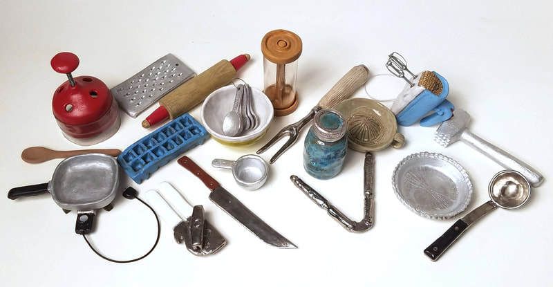 miniature clay sculptures of items from Martha Rosler's Semiotics of the kitchen