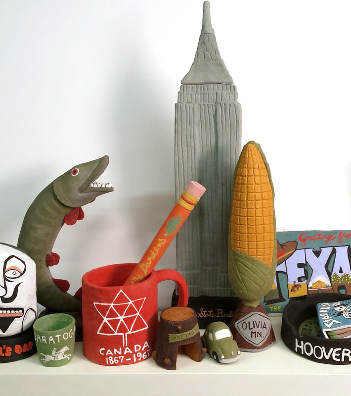a grouping of oversized holiday souvenirs rendered in clay.