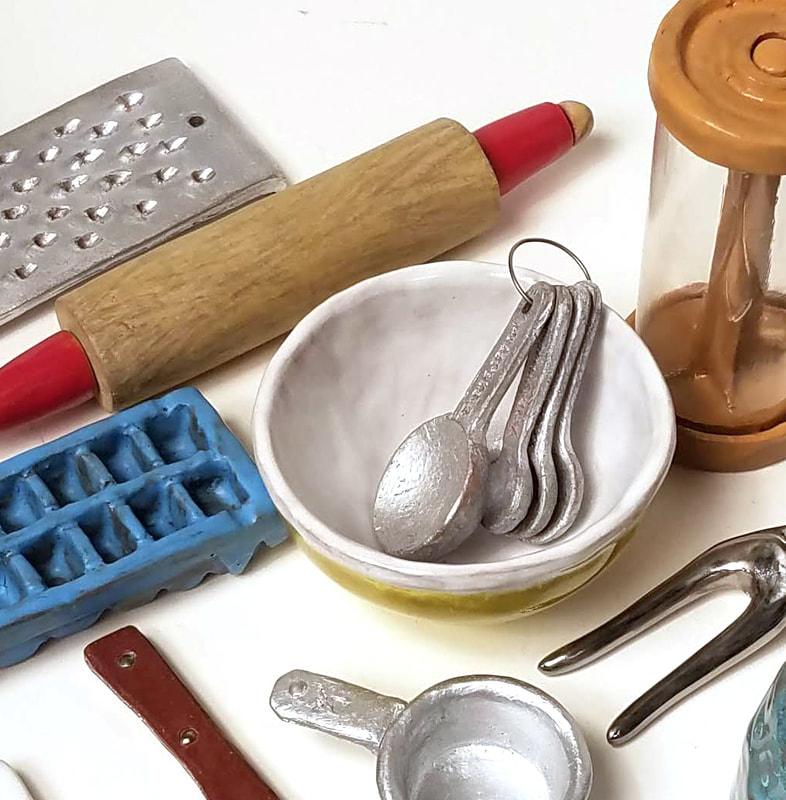 detail of sculpture of small clay objects for the kitchen